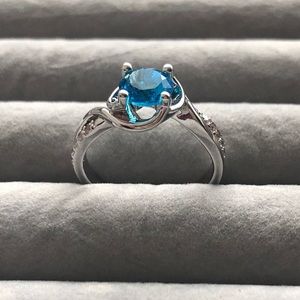 Blue Topaz Ring w/rhodium plated silver band